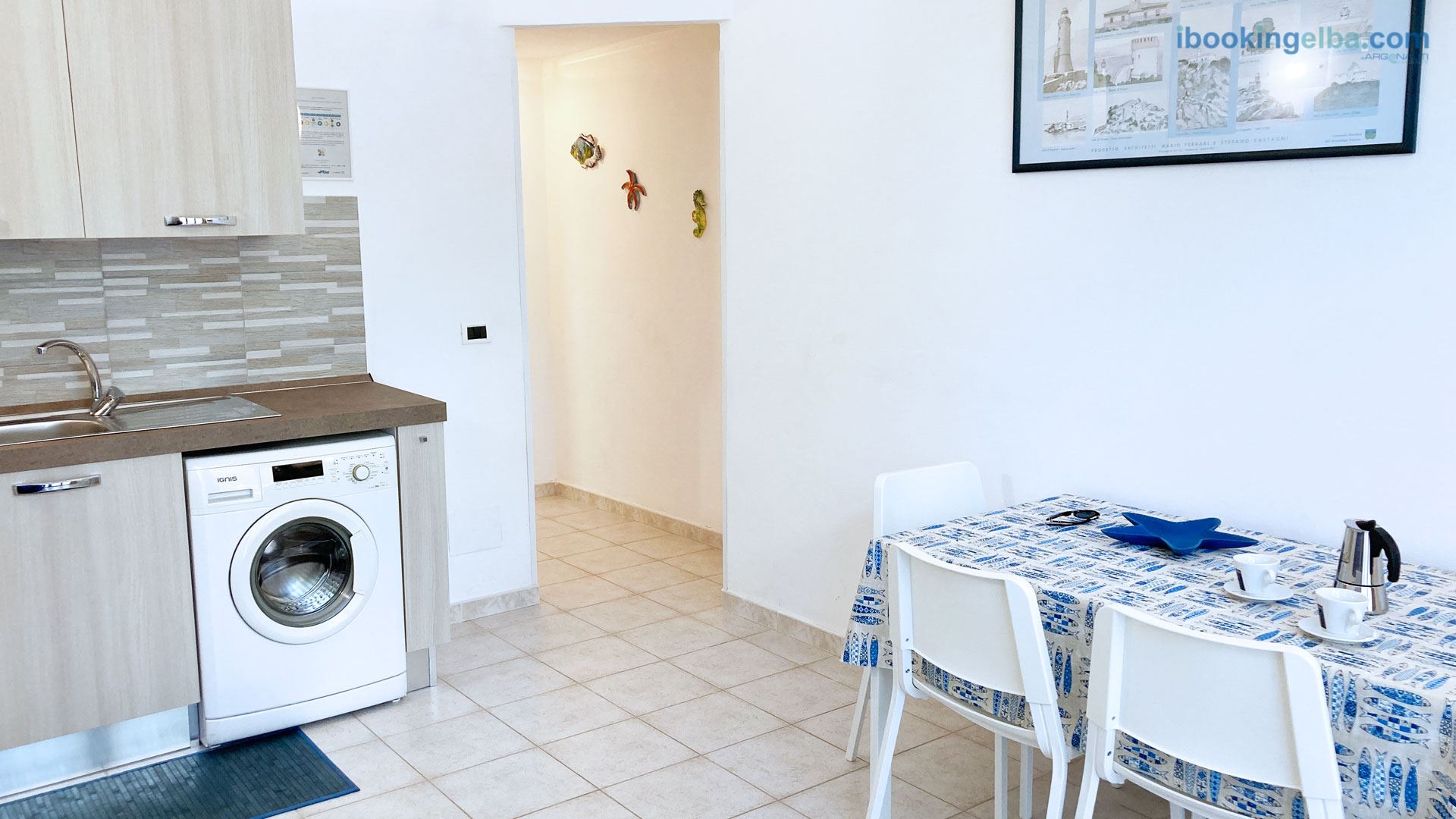Casa Gioia - Soggiorno con piano cottura e lavatrice